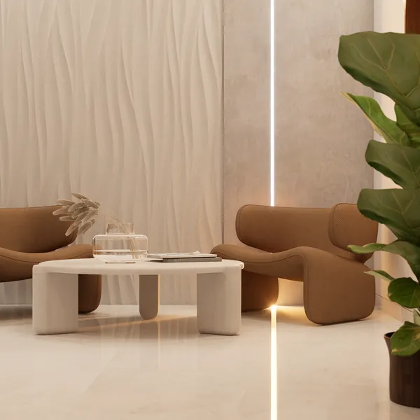Sculpted lounge chairs by a textured wall