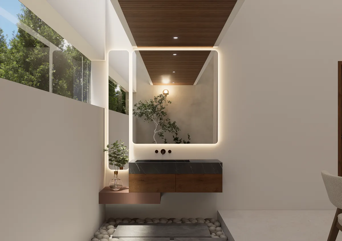 Wash area with a backlit mirror and stone vanity