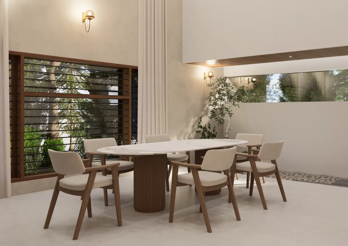 Dining table with cream chairs beside a slatted garden window