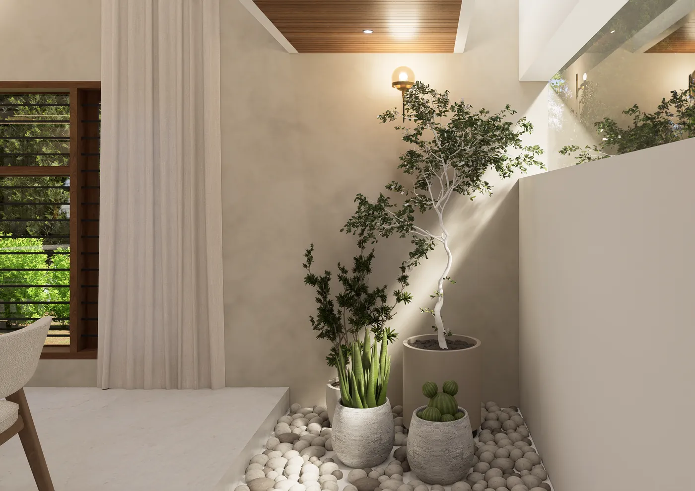 Indoor courtyard garden with a tree, pebbles and potted plants